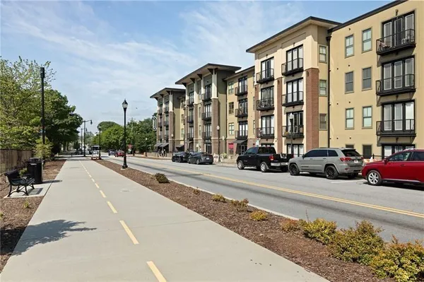a city street lined with buildings and cars