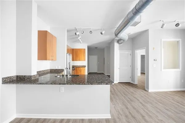 a kitchen with granite countertop a sink and a granite counter tops