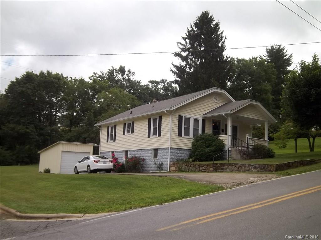 635 Allen Farm Road Canton, NC 28716 - Photo 2 of 11 a front view of a house with a garden