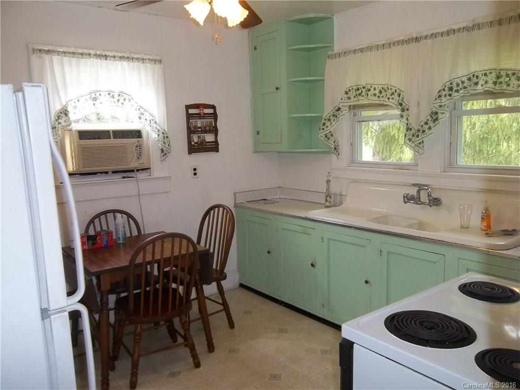 635 Allen Farm Road Canton, NC 28716 - Photo 3 of 11 a kitchen with a sink a stove and a microwave
