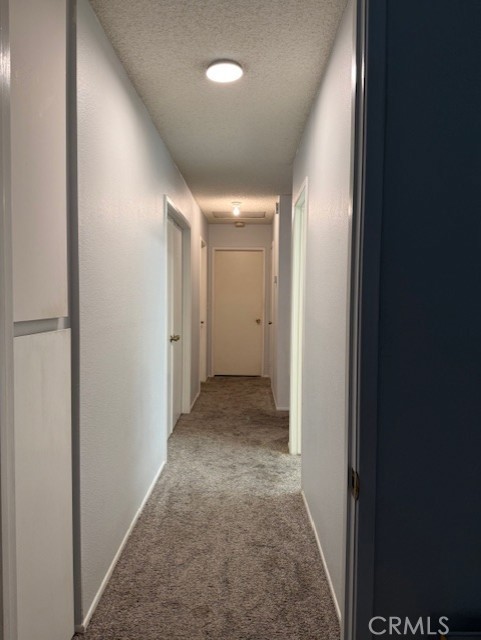 12446 Mt Baldy Drive Victorville, CA 92392 - Photo 22 of 36 Hallway to the Garage