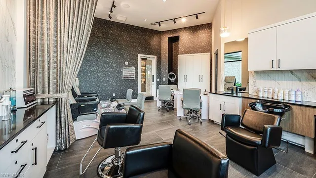 a kitchen with a sink dishwasher a stove and a refrigerator with wooden cabinets