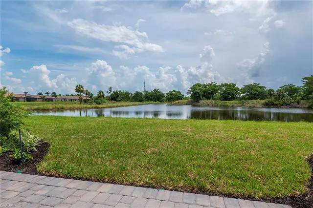 a view of a lake with a big yard