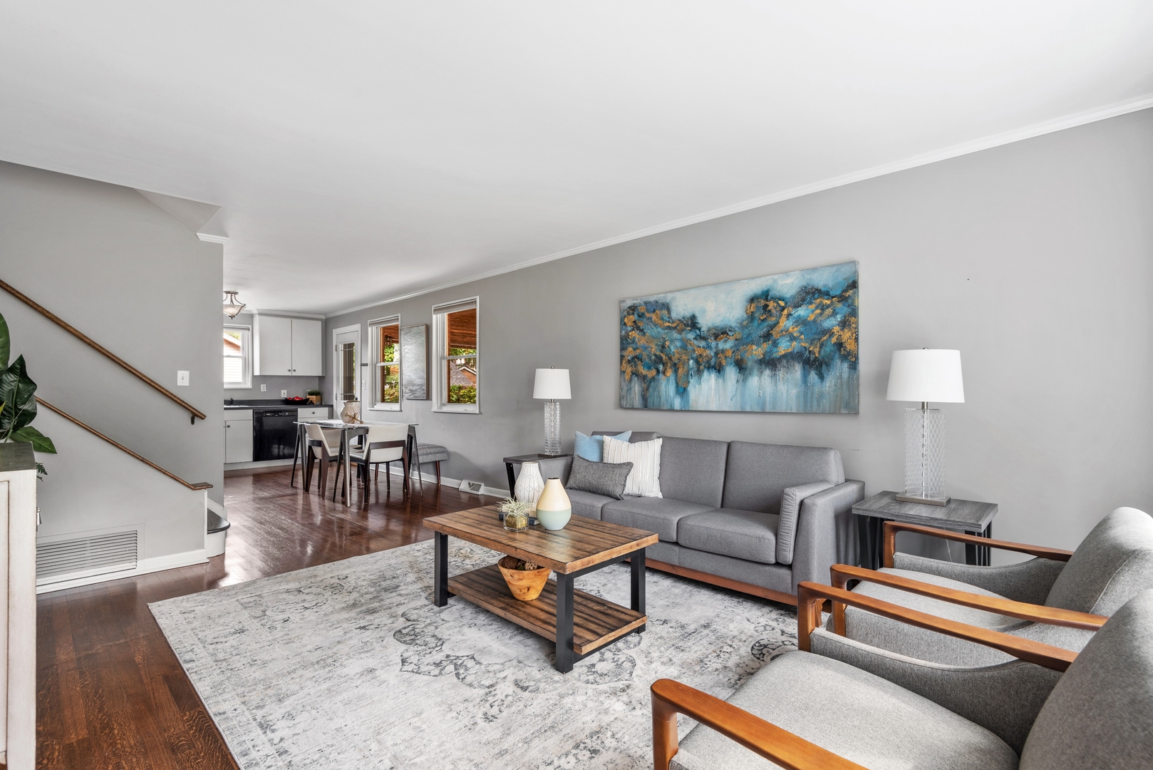 2040 Central Avenue Wilmette, IL 60091 - Photo 2 of 22 a living room with furniture a rug and a painting on the wall