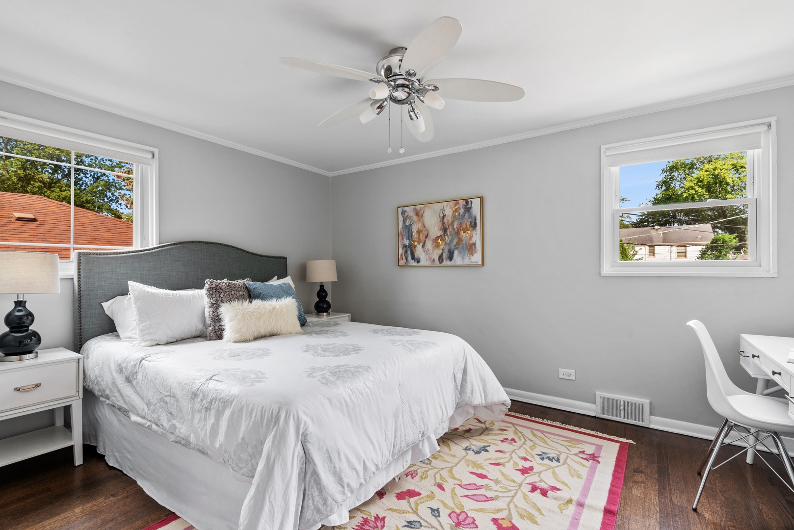 2040 Central Avenue Wilmette, IL 60091 - Photo 12 of 22 a bedroom with a bed and a chandelier