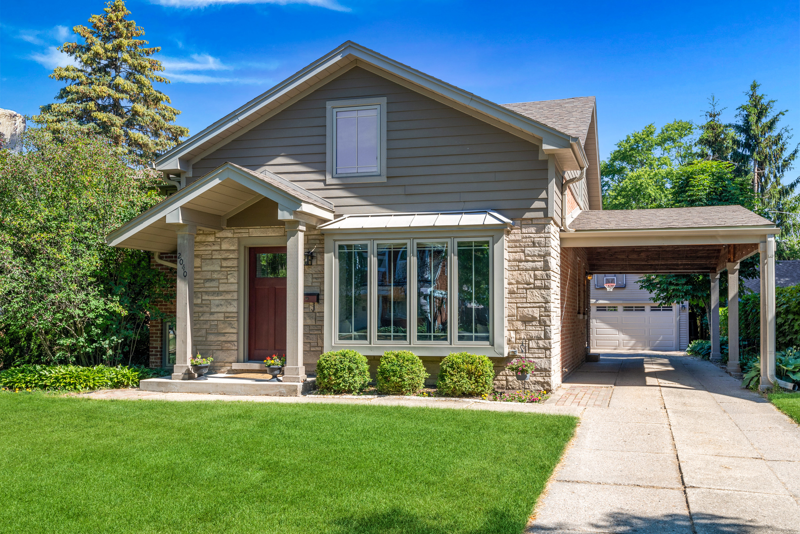 2040 Central Avenue Wilmette, IL 60091 - Photo 16 of 22 a front view of a house with a yard