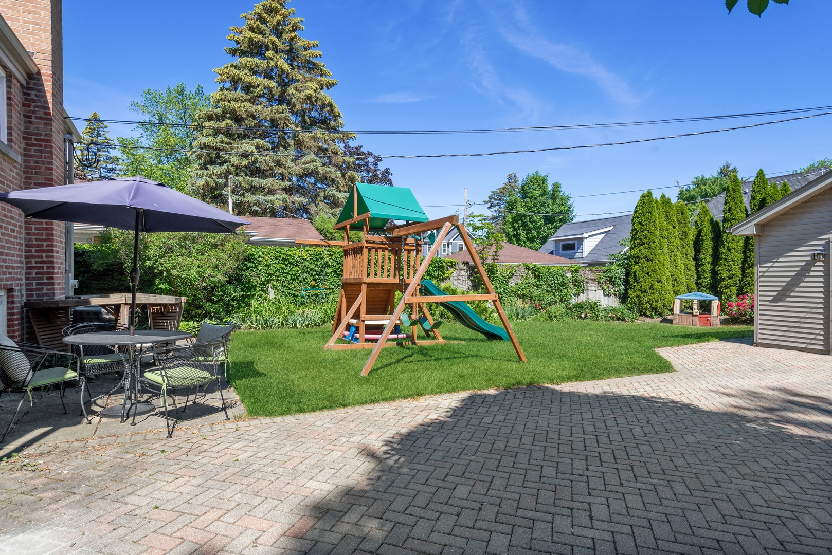 2040 Central Avenue Wilmette, IL 60091 - Photo 17 of 22 a view of backyard with table and chairs and potted plants