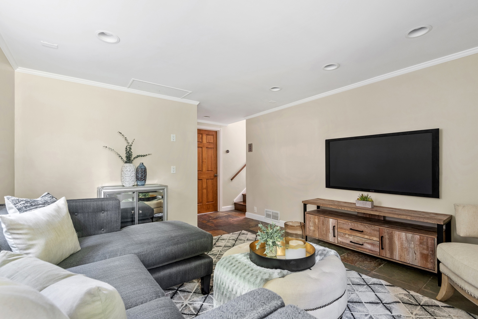2040 Central Avenue Wilmette, IL 60091 - Photo 8 of 22 a living room with furniture and a flat screen tv