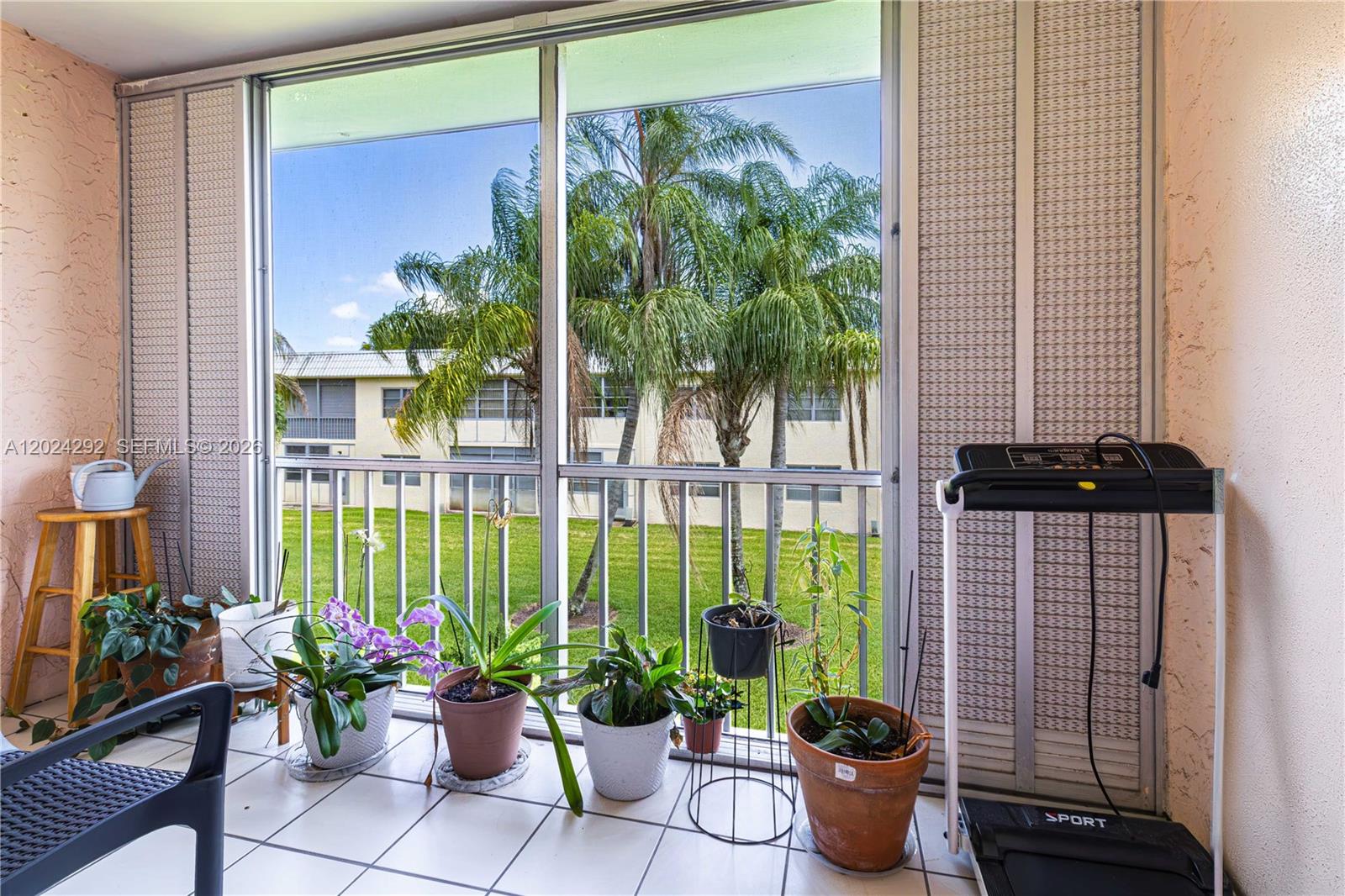 9780 Marina Boulevard, Unit 424 Boca Raton, FL 33428 - Photo 15 of 32 a view of a potted flower in front of a window