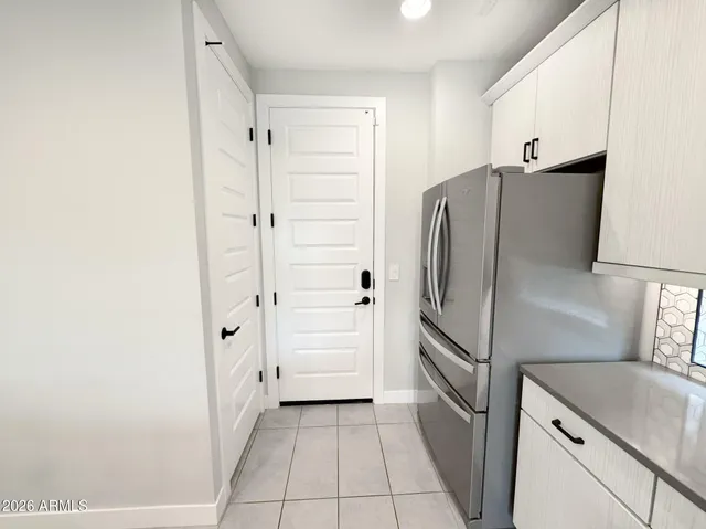 a kitchen with stainless steel appliances granite countertop a sink a counter space and cabinets