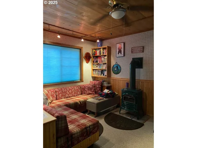 a living room with furniture and a rug