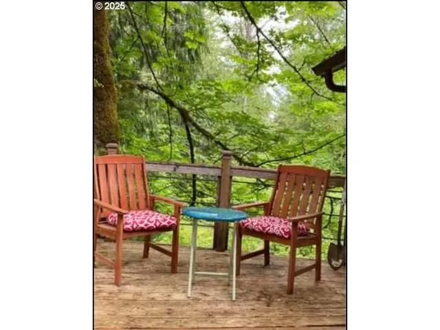 a balcony with chairs and a table