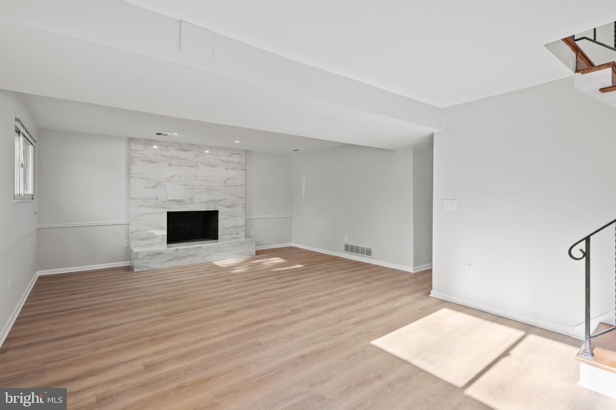 100 Oak Drive Annapolis, MD 21403 - Photo 11 of 32 a view of empty room with wooden floor and fireplace