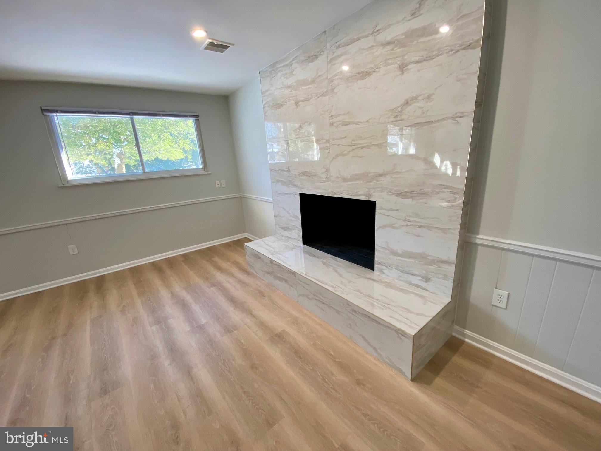 100 Oak Drive Annapolis, MD 21403 - Photo 15 of 32 a living room with furniture and a fireplace