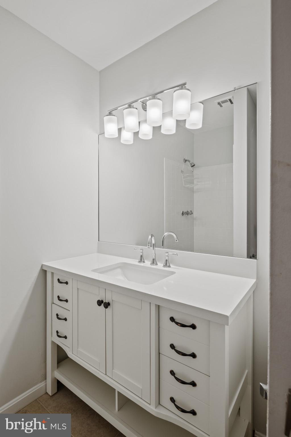 100 Oak Drive Annapolis, MD 21403 - Photo 16 of 32 a bathroom with a sink double vanity and a mirror