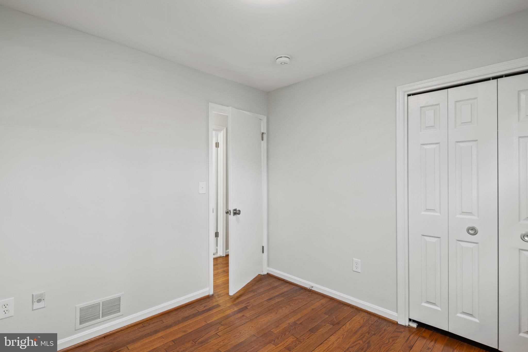100 Oak Drive Annapolis, MD 21403 - Photo 21 of 32 a view of an empty room with wooden floor