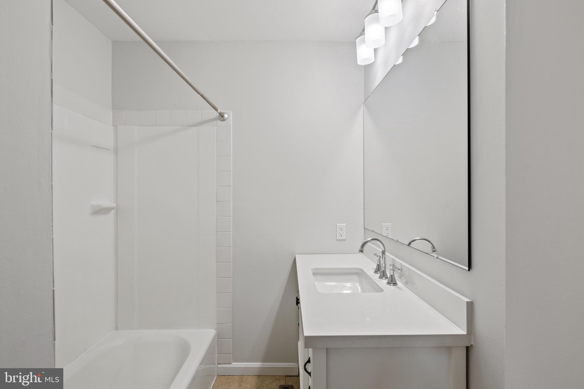 100 Oak Drive Annapolis, MD 21403 - Photo 22 of 32 a bathroom with a sink a toilet and shower