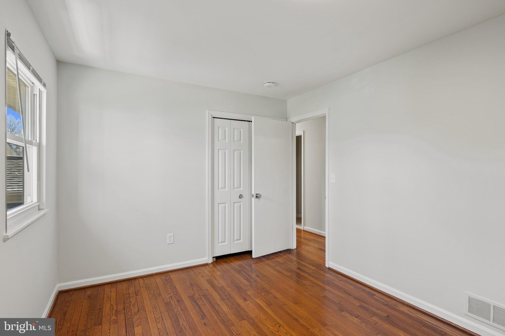 100 Oak Drive Annapolis, MD 21403 - Photo 24 of 32 a view of an empty room with wooden floor and a window