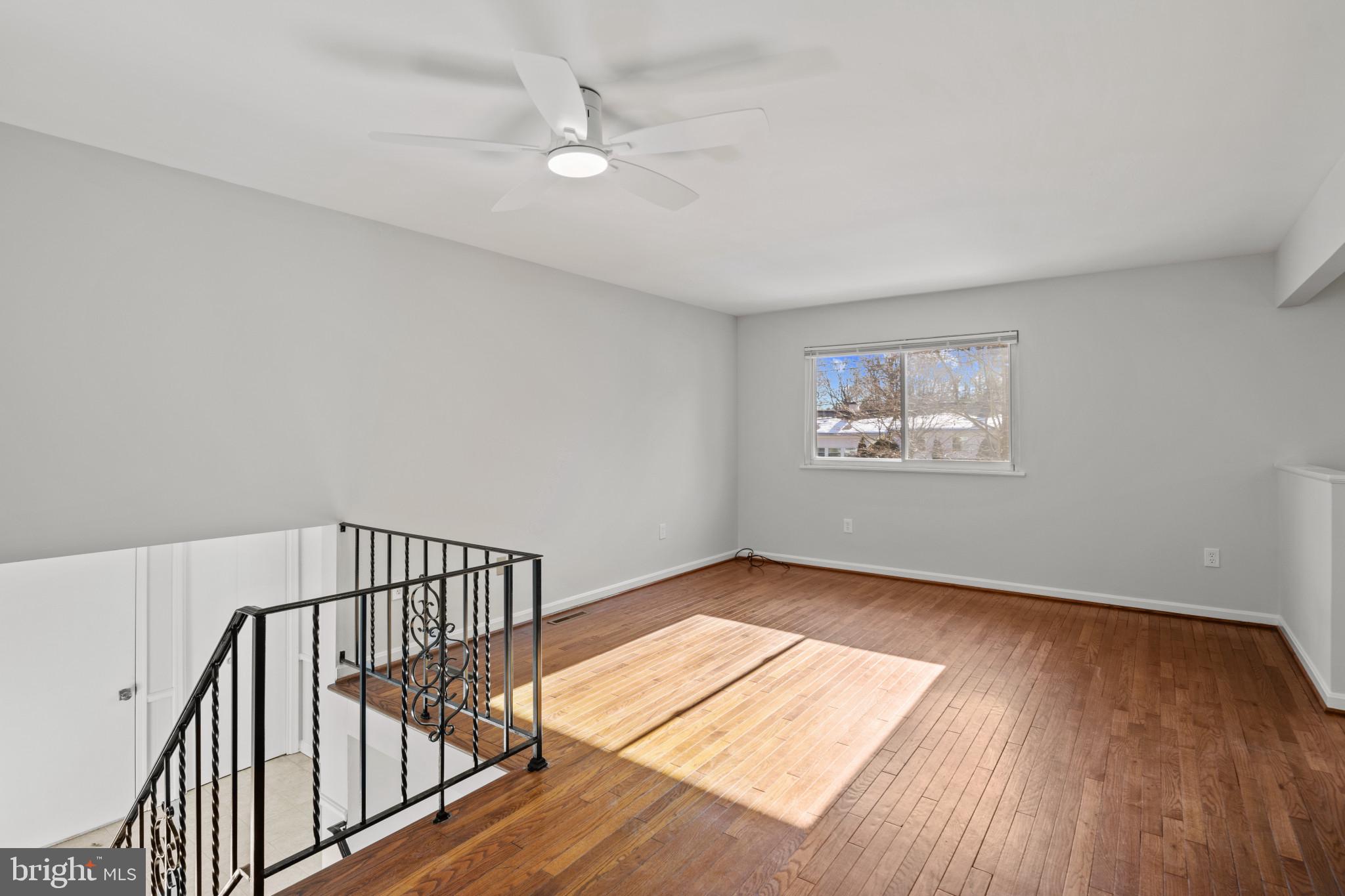 100 Oak Drive Annapolis, MD 21403 - Photo 5 of 32 a view of an empty room with wooden floor and a window