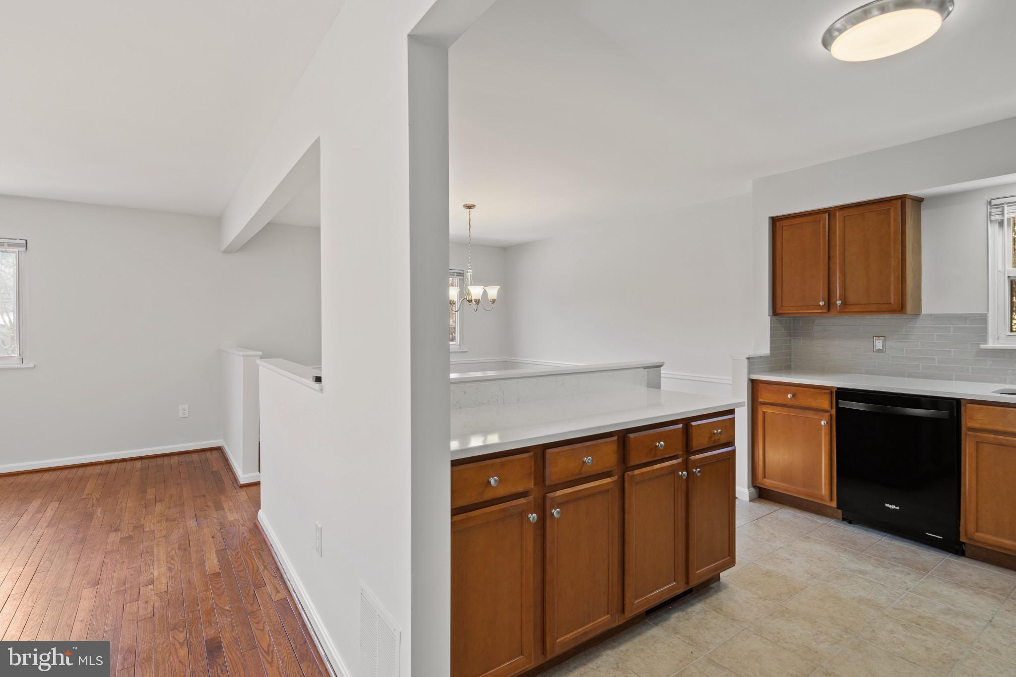 100 Oak Drive Annapolis, MD 21403 - Photo 8 of 32 a kitchen with stainless steel appliances granite countertop a stove and a wooden floors