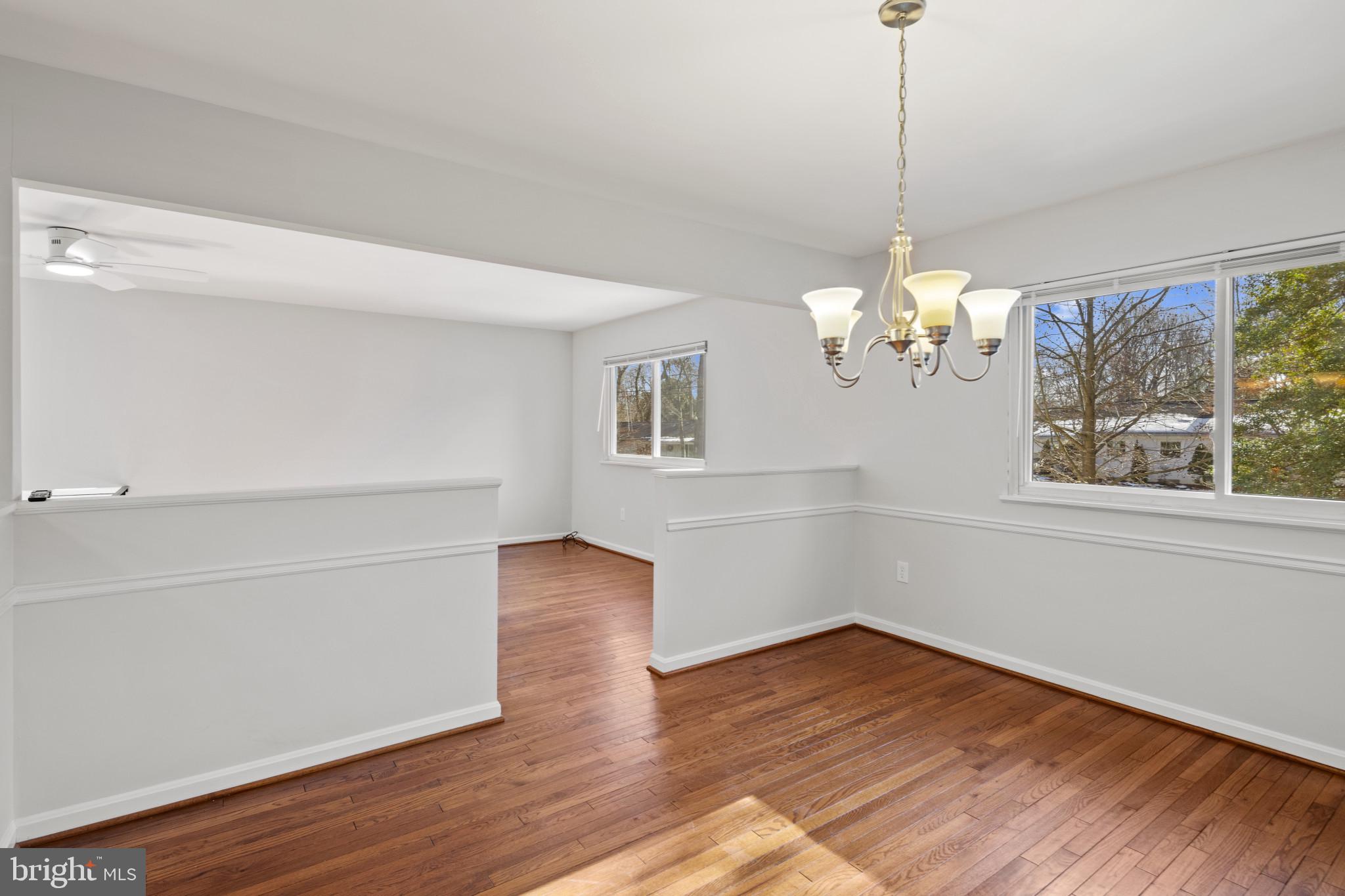 100 Oak Drive Annapolis, MD 21403 - Photo 9 of 32 a view of an empty room with wooden floor and a window