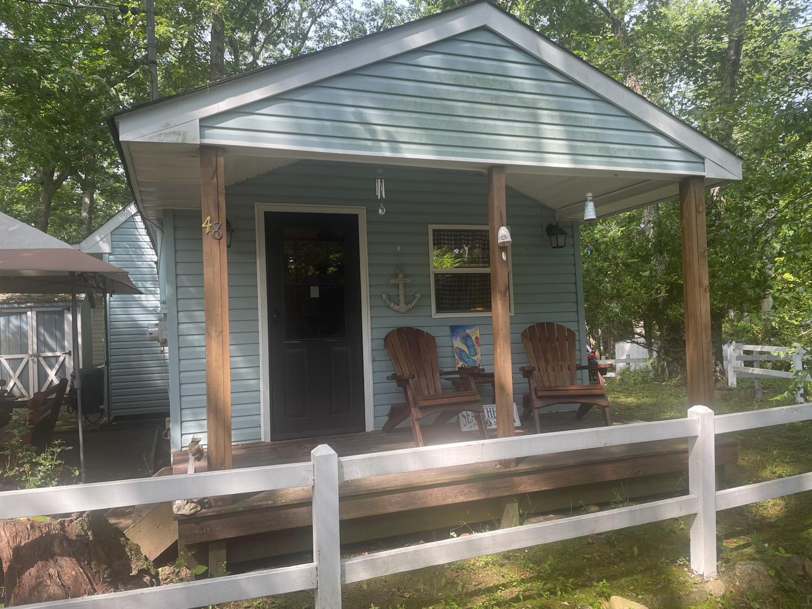 a view of house with backyard