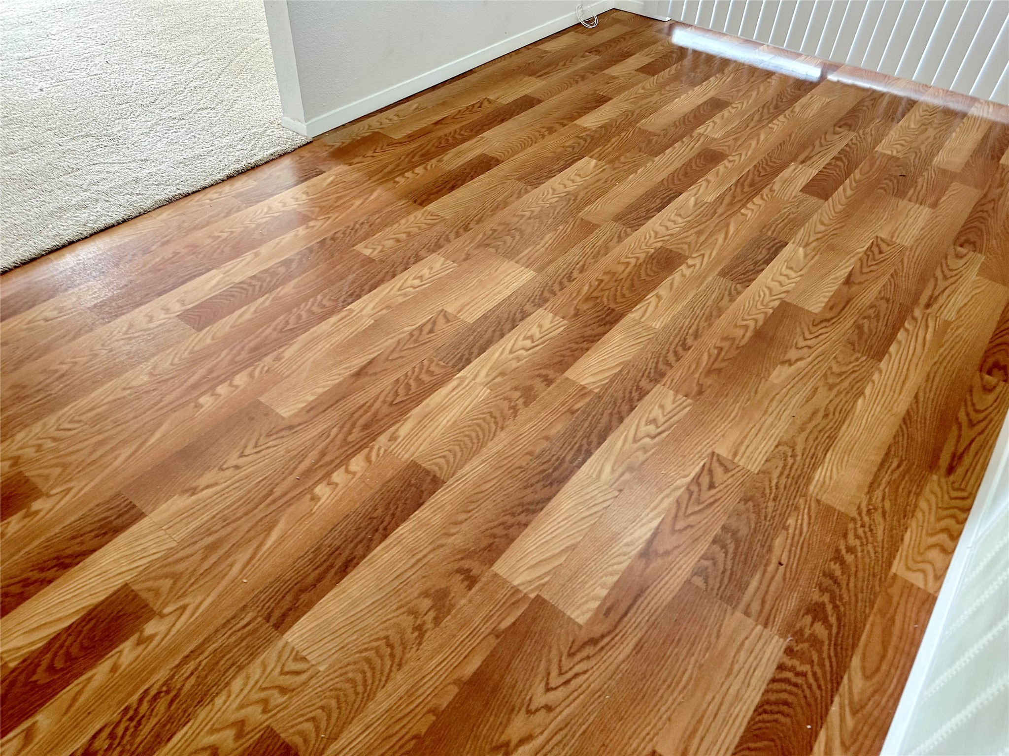 3103 Cliff Swallow Court Spring, TX 77373 - Photo 11 of 33 Close-up of beautiful laminate flooring in dining and kitchen.