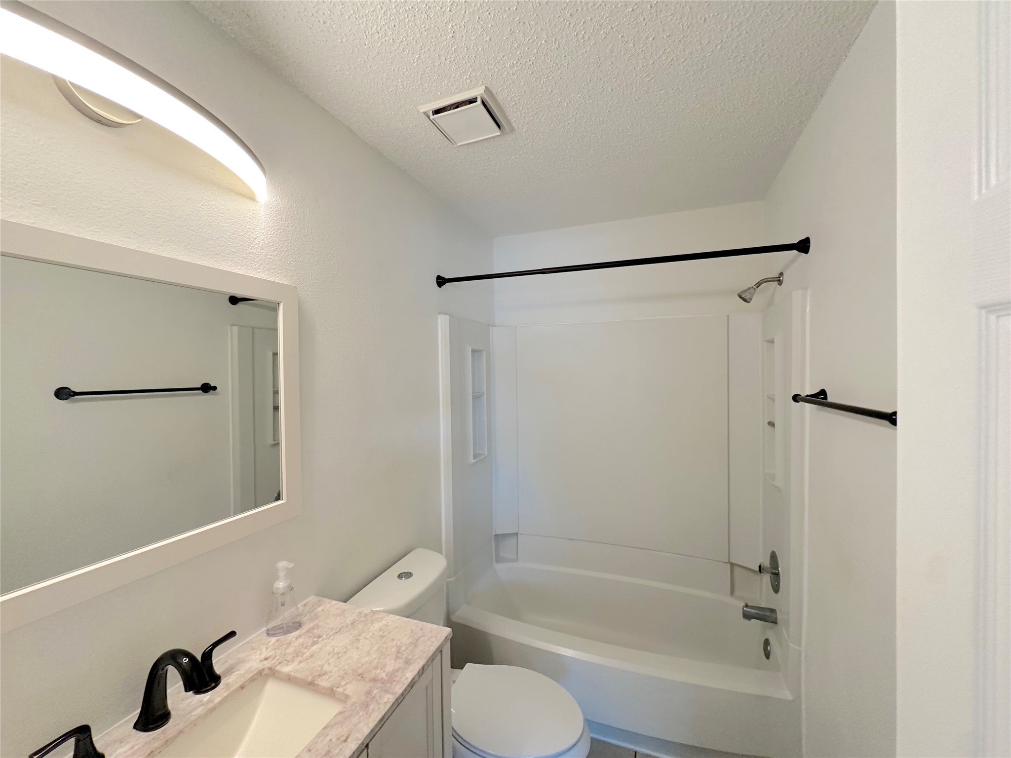 3103 Cliff Swallow Court Spring, TX 77373 - Photo 18 of 33 View of primary ensuite bath with updated vanity, toilet, fixtures and lighting.