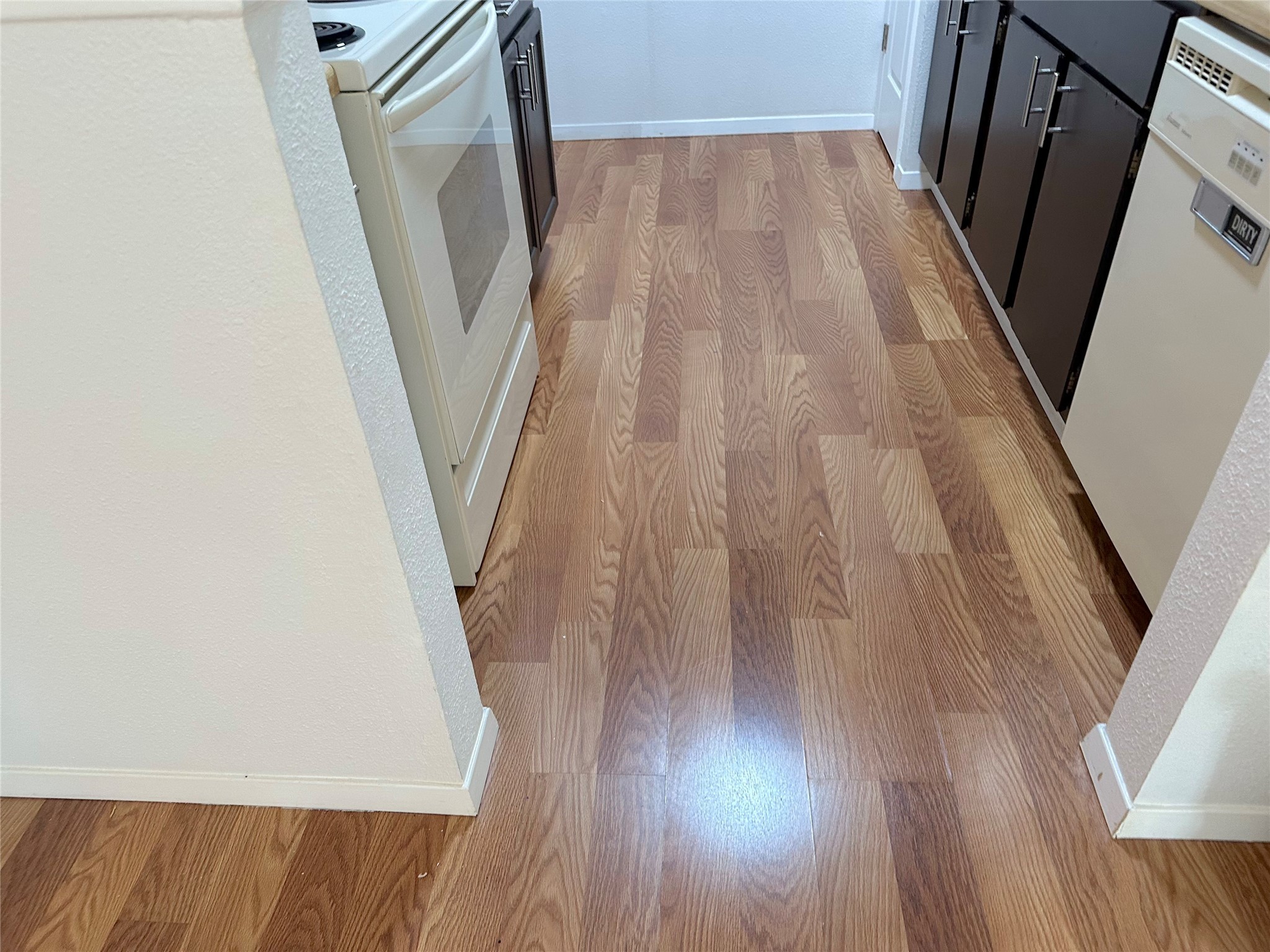 3103 Cliff Swallow Court Spring, TX 77373 - Photo 9 of 33 Laminate flooring in kitchen.