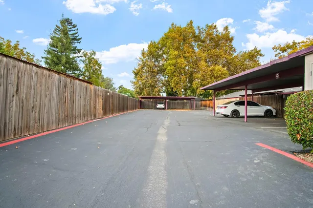 a view of street with parked cars