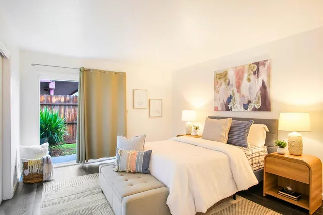 a bedroom with a bed and a couch