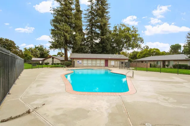 a view of swimming pool with sitting area