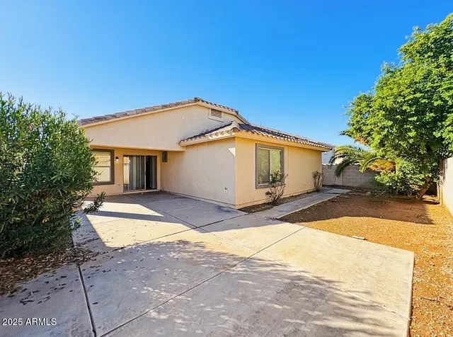 a view of house and outdoor space with yard