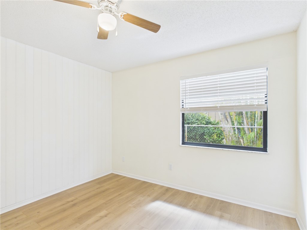 225 Midvale Terrace Sebastian, FL 32958 - Photo 20 of 25 an empty room with a window and a ceiling fan