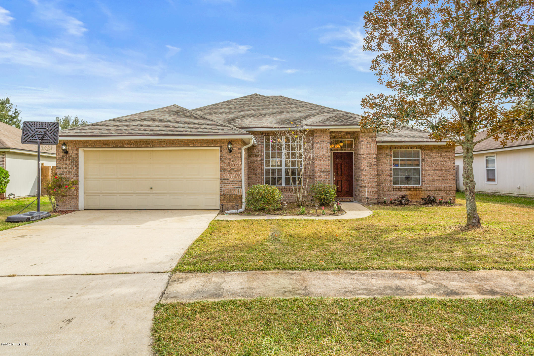 8145 Leafcrest Drive Jacksonville, FL 32244 - Photo 1 of 25 a front view of a house with a yard