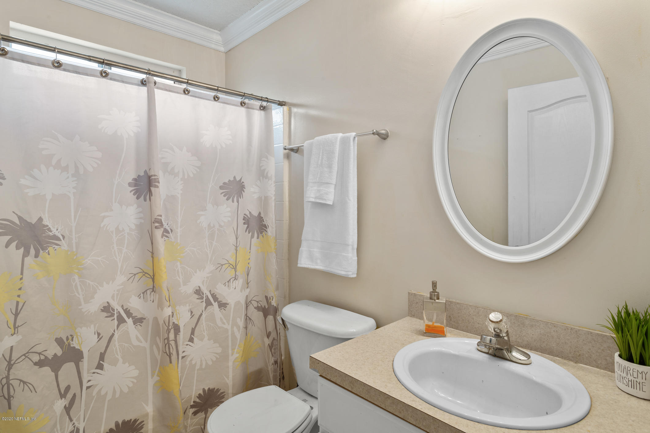 8145 Leafcrest Drive Jacksonville, FL 32244 - Photo 17 of 25 a bathroom with a sink toilet and shower