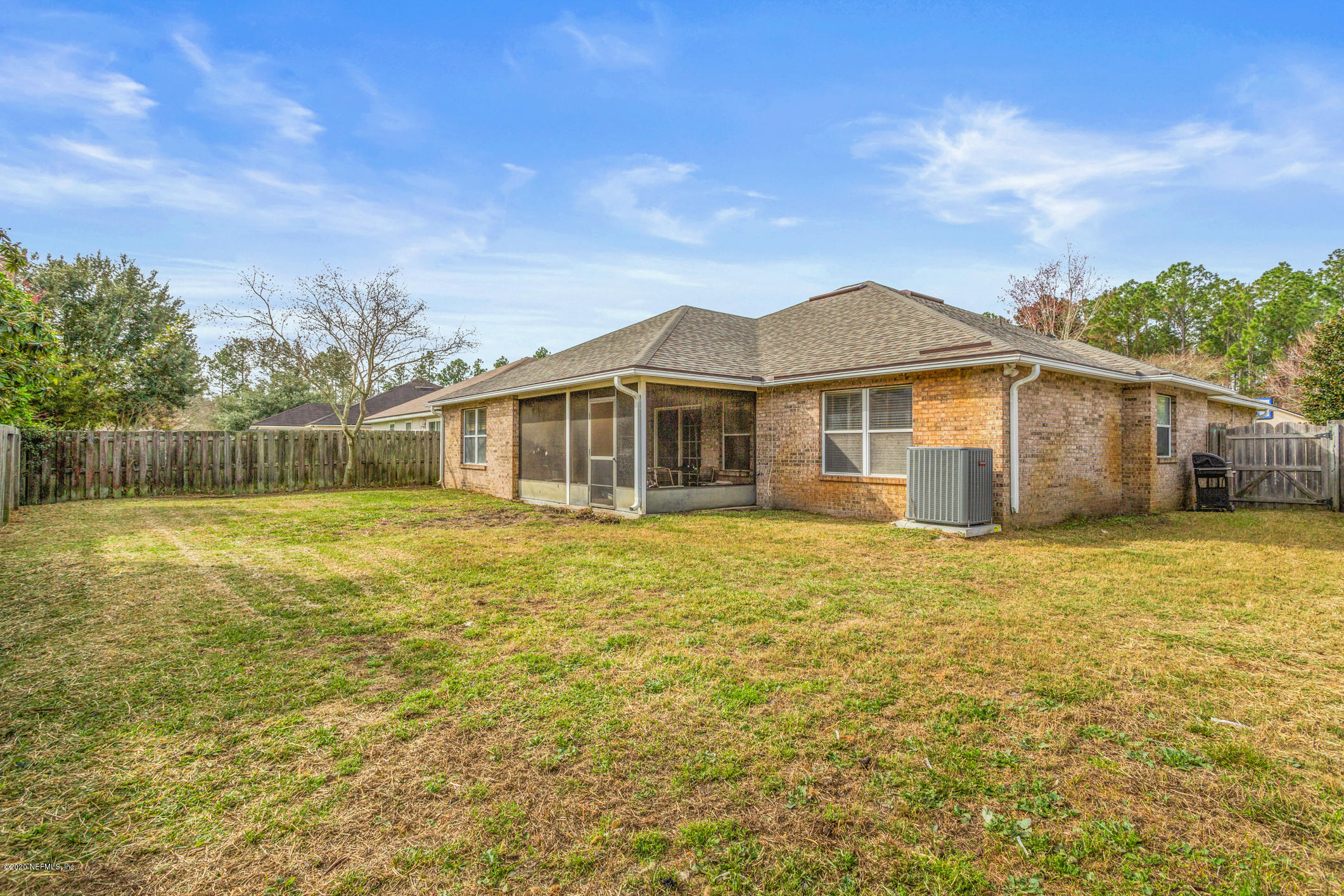 8145 Leafcrest Drive Jacksonville, FL 32244 - Photo 21 of 25 a front view of a house with a garden