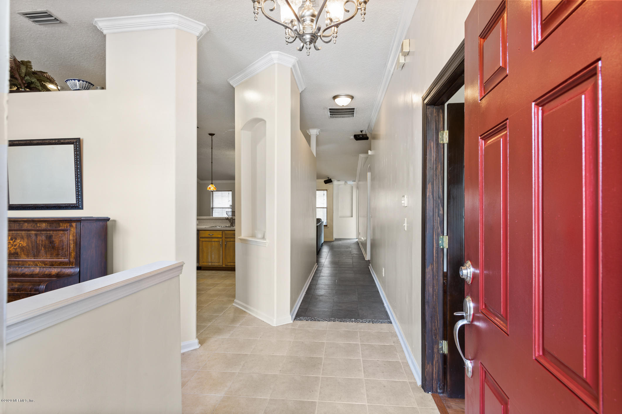 8145 Leafcrest Drive Jacksonville, FL 32244 - Photo 4 of 25 a view of a hallway with wooden floor and staircase