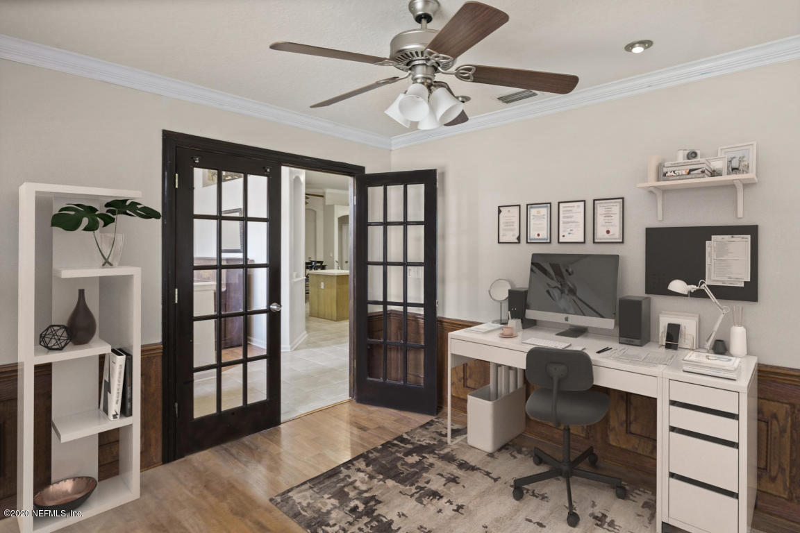 8145 Leafcrest Drive Jacksonville, FL 32244 - Photo 6 of 25 a workspace with furniture a window and a chandelier