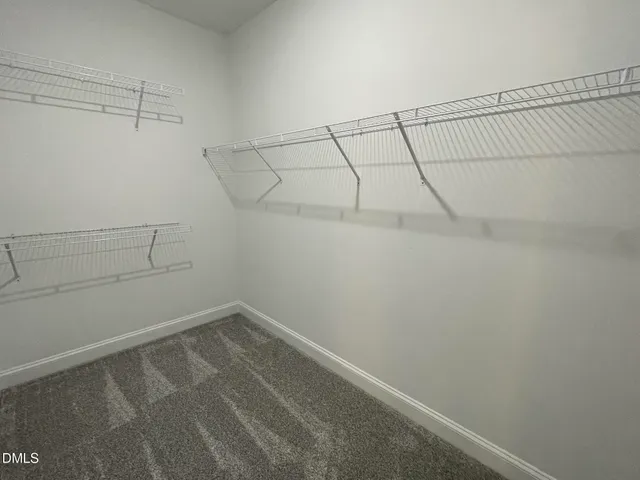 a spacious bathroom with a granite countertop sink and a mirror
