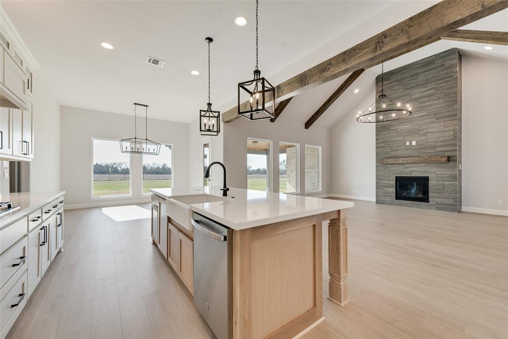 5291 Sunset Road Caddo Mills, TX 75135 - Photo 14 of 39 a kitchen with stainless steel appliances granite countertop a stove and a kitchen island