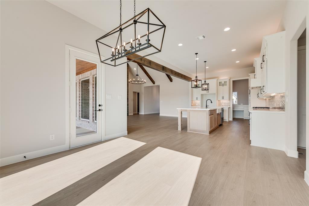 5291 Sunset Road Caddo Mills, TX 75135 - Photo 19 of 39 a open kitchen with white cabinets and stainless steel appliances