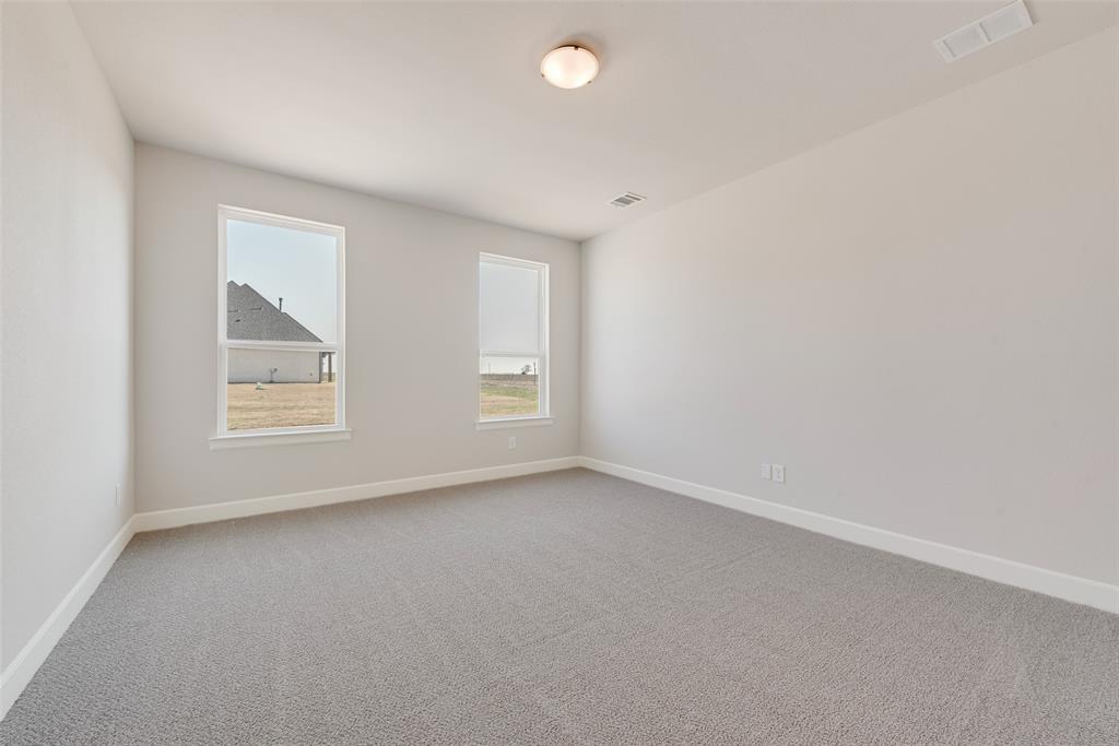 5291 Sunset Road Caddo Mills, TX 75135 - Photo 22 of 39 an empty room with windows and closet