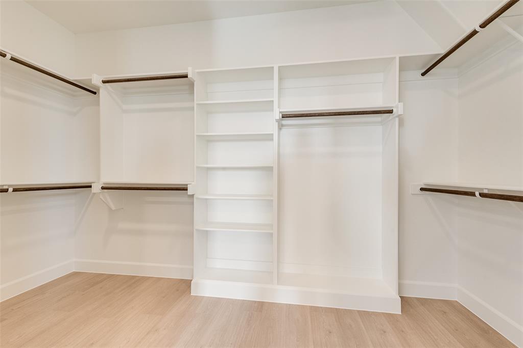 5291 Sunset Road Caddo Mills, TX 75135 - Photo 30 of 39 a view of an empty walk in closet with empty racks