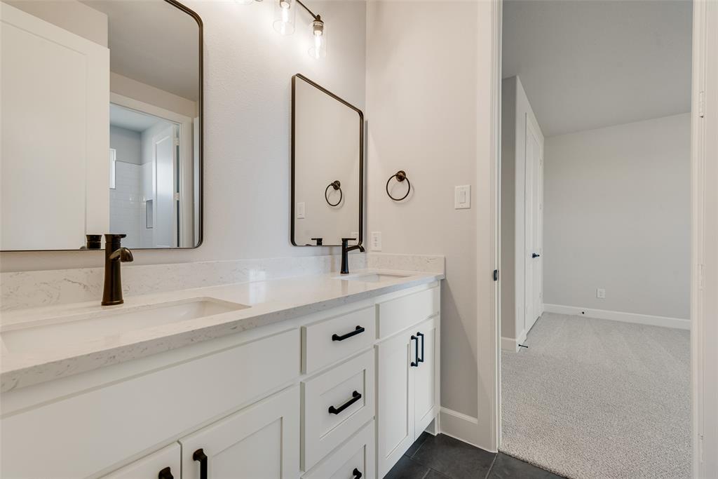 5291 Sunset Road Caddo Mills, TX 75135 - Photo 32 of 39 a bathroom with a double vanity sink and mirror