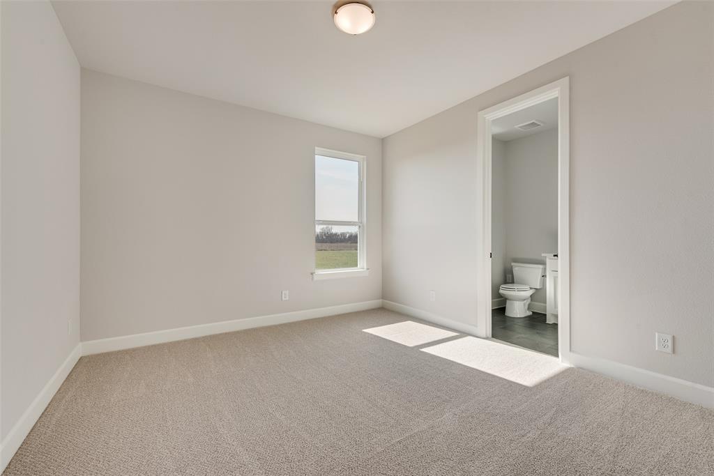 5291 Sunset Road Caddo Mills, TX 75135 - Photo 35 of 39 a view of an empty room with a window and a bathroom