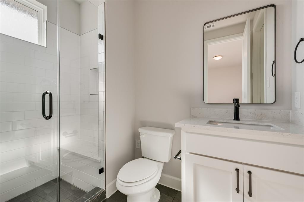 5291 Sunset Road Caddo Mills, TX 75135 - Photo 36 of 39 a bathroom with a granite countertop sink toilet and shower