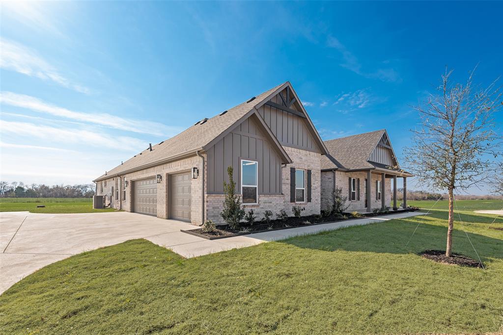 5291 Sunset Road Caddo Mills, TX 75135 - Photo 4 of 39 a front view of a house with a yard