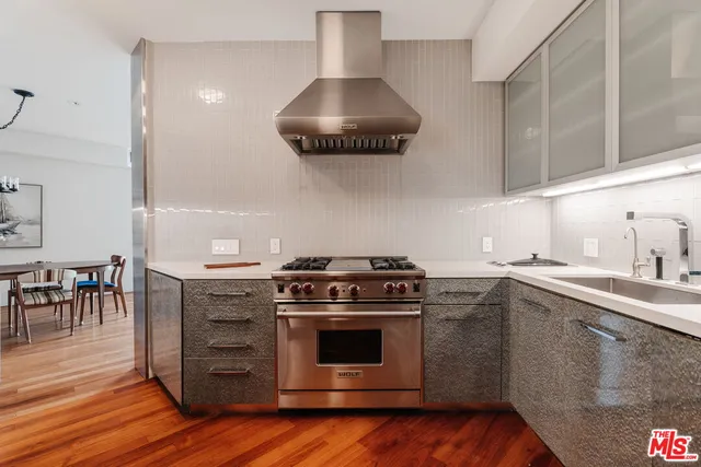 a kitchen with a stove and a sink
