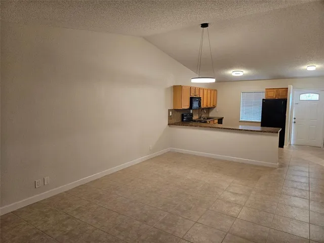 a view of a kitchen with a sink and a window